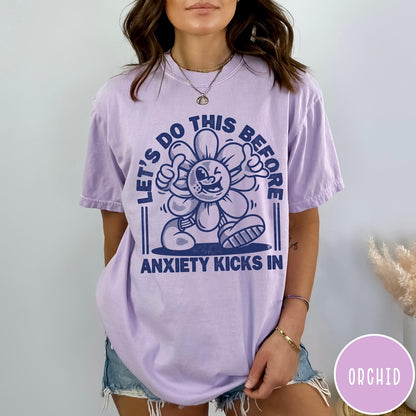 Comfort Colors tee in Orchid featuring retro graphic style winking flower character with anxiety text design