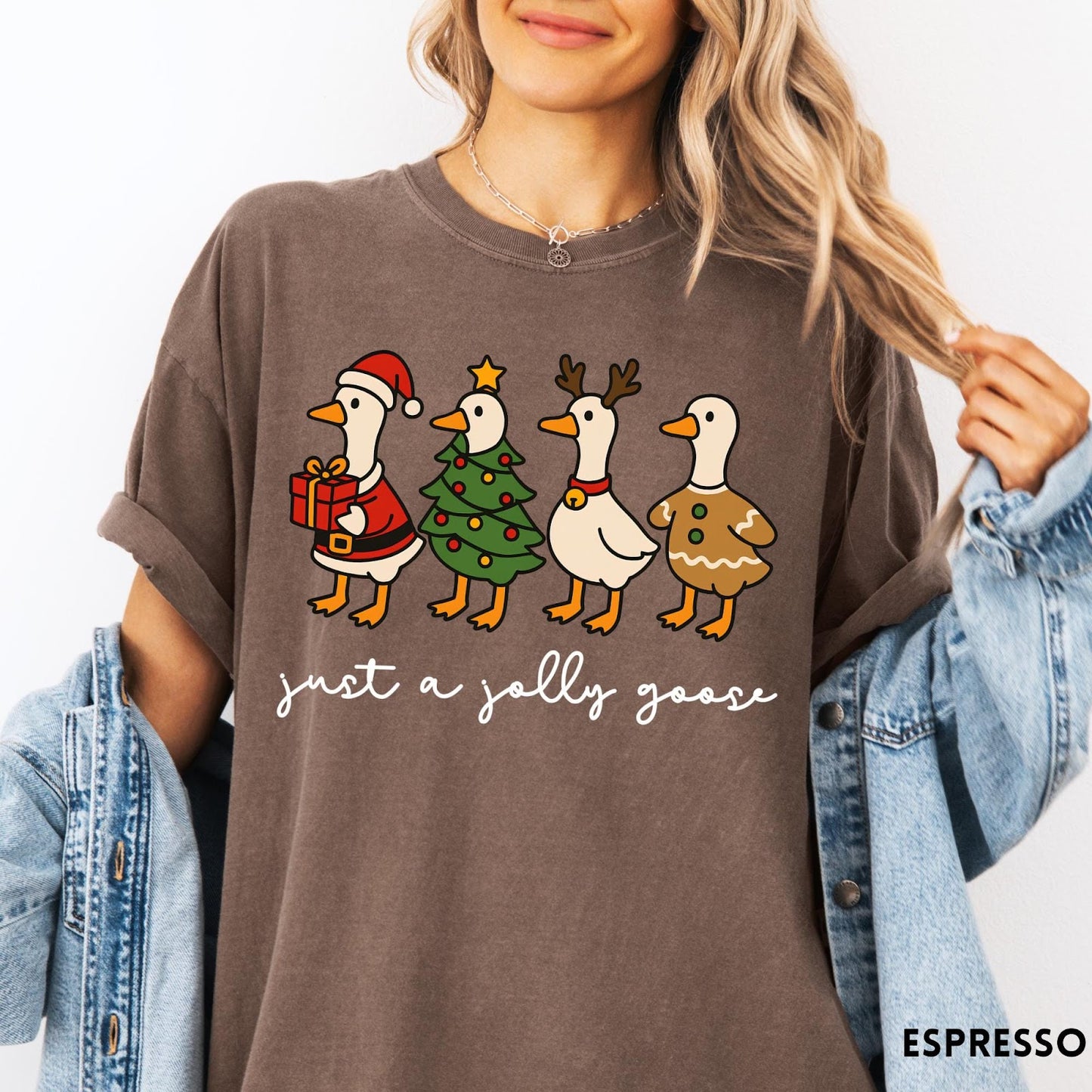 Comfort Colors tee in Espresso featuring festive geese dressed as Santa, Christmas tree, reindeer, and gingerbread