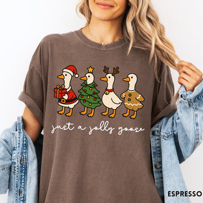Comfort Colors tee in Espresso featuring festive geese dressed as Santa, Christmas tree, reindeer, and gingerbread
