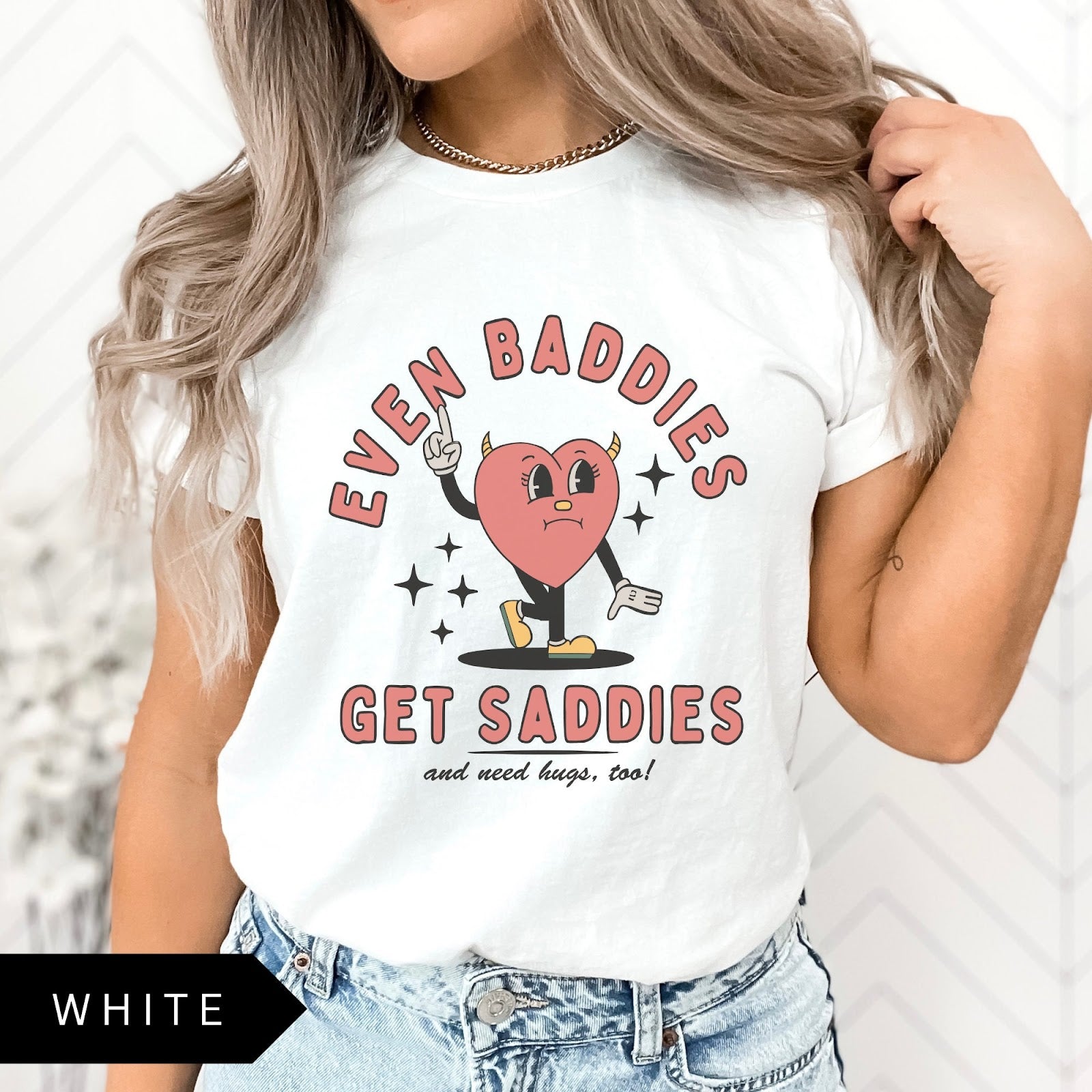 Comfort Colors tee in White featuring retro style sad heart character with horns and text graphic