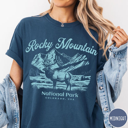 Comfort Colors tee in Midnight featuring vintage style graphic of an elk standing in front of mountains