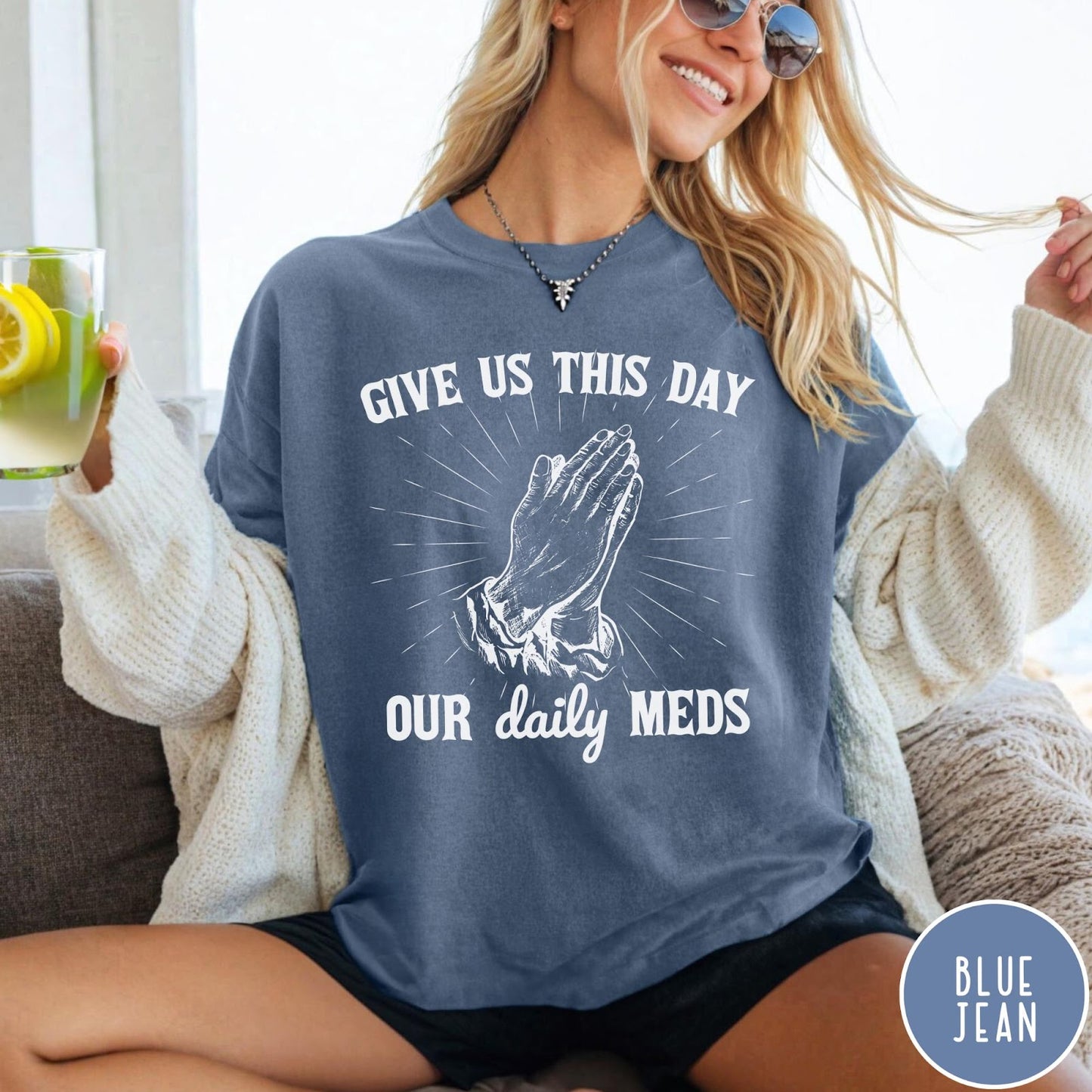Comfort Colors tee in Blue Jean featuring graphic style praying hands with text Give Us This Day Our Daily Meds
