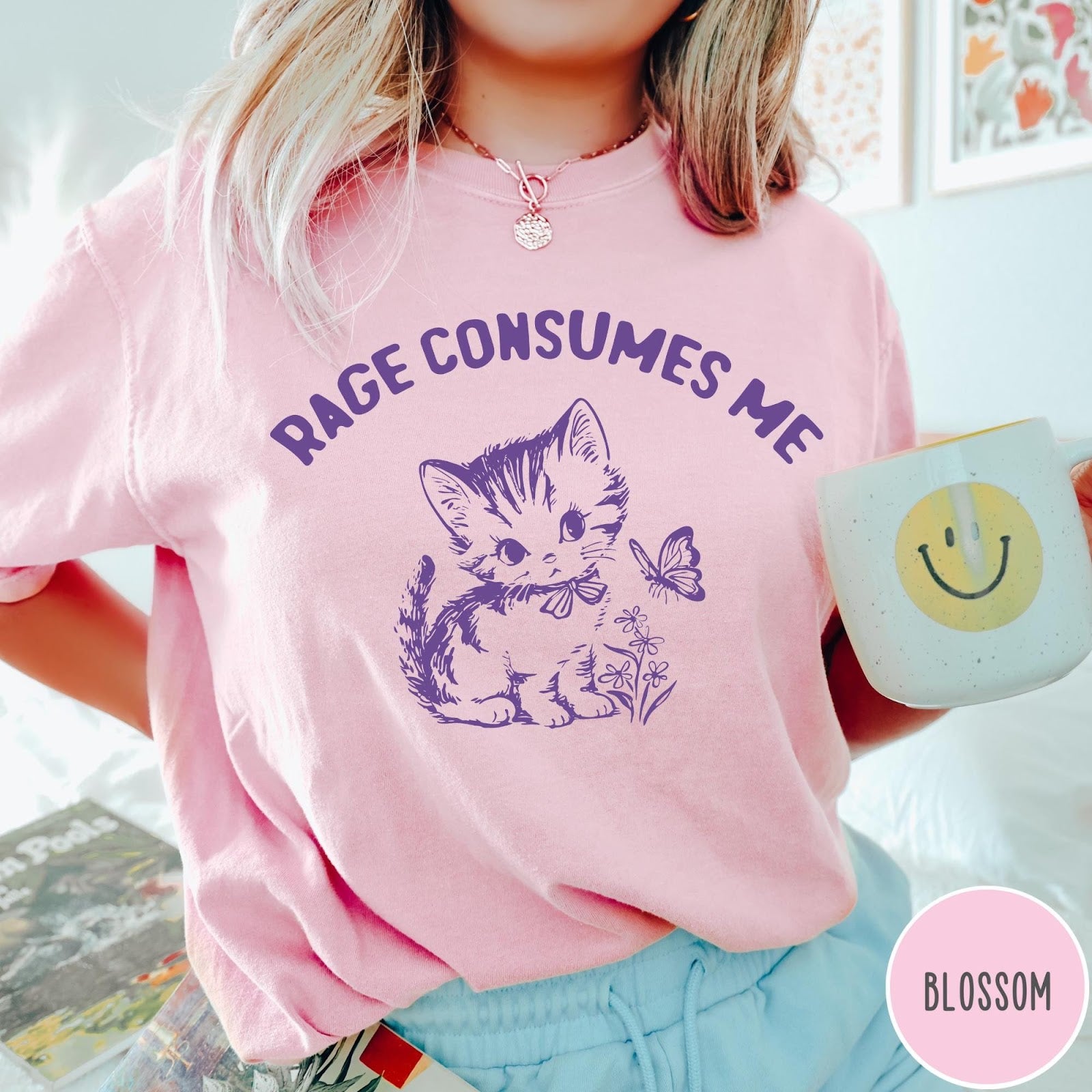 Comfort Colors tee in Blossom featuring kitten design with butterfly and flowers and text Rage Consumes Me