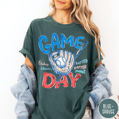 Comfort Colors tee in Blue Spruce featuring baseball design with glove, ball, bat, and Game Day text graphic