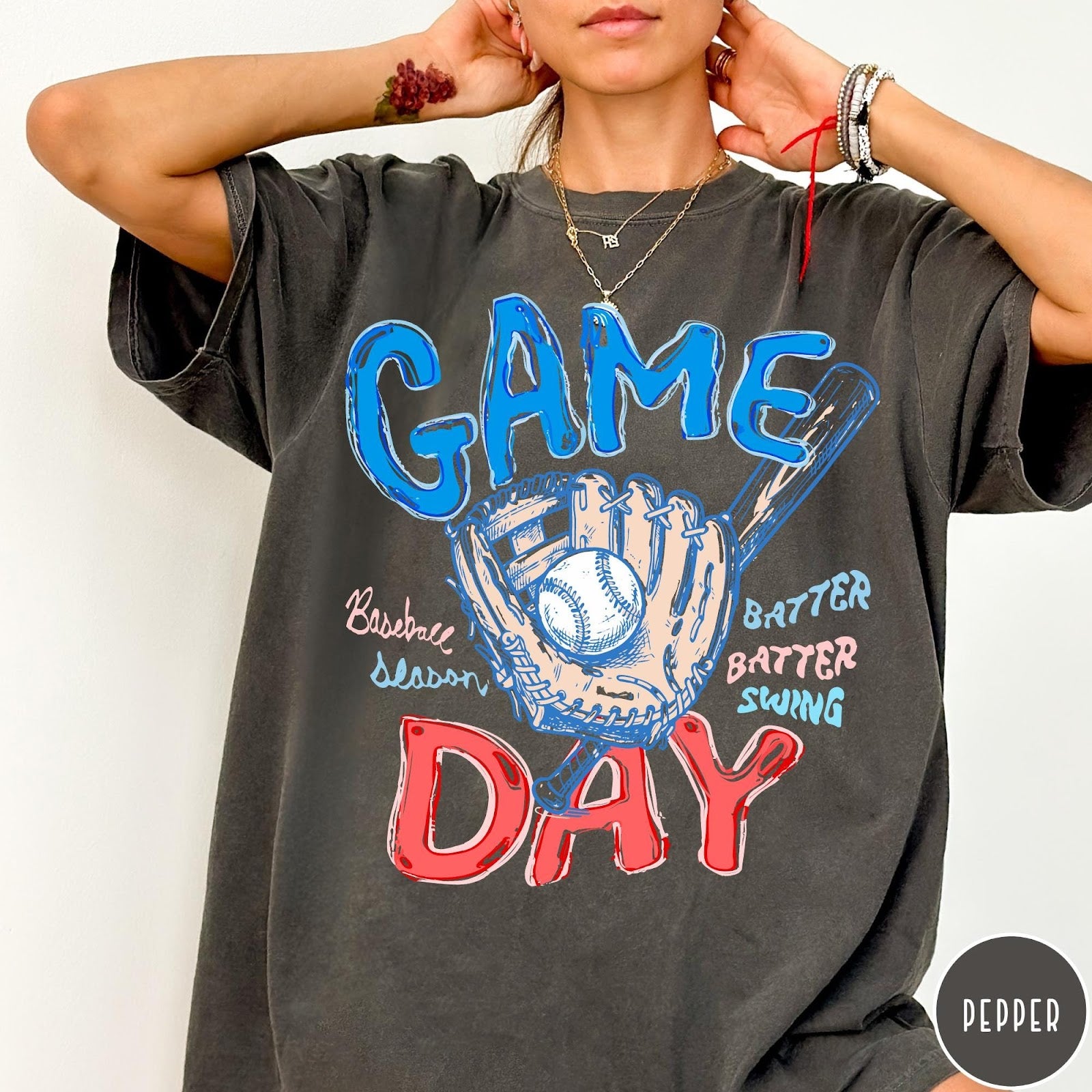 Comfort Colors tee in Pepper featuring baseball design with glove, ball, bat, and Game Day text graphic
