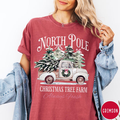 Comfort Colors tee in Crimson featuring vintage style Christmas tree farm truck graphic with snowy pine trees