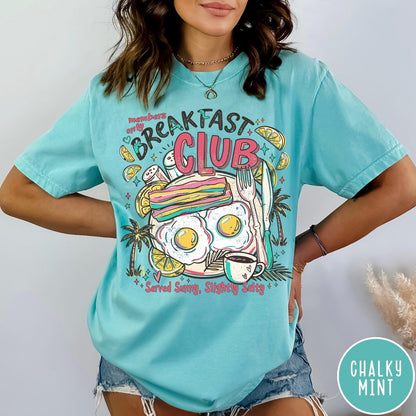 Comfort Colors tee in Chalky Mint featuring breakfast food graphic with bacon, eggs, coffee, and palm trees.