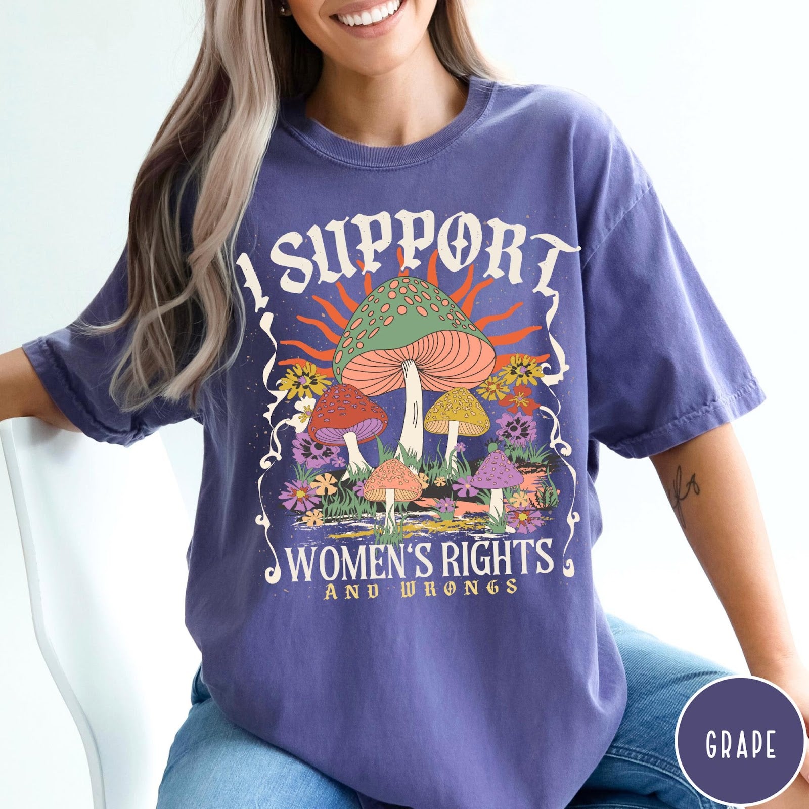 Comfort Colors tee in Grape featuring retro graphic design with colorful mushrooms, flowers, and sun illustration