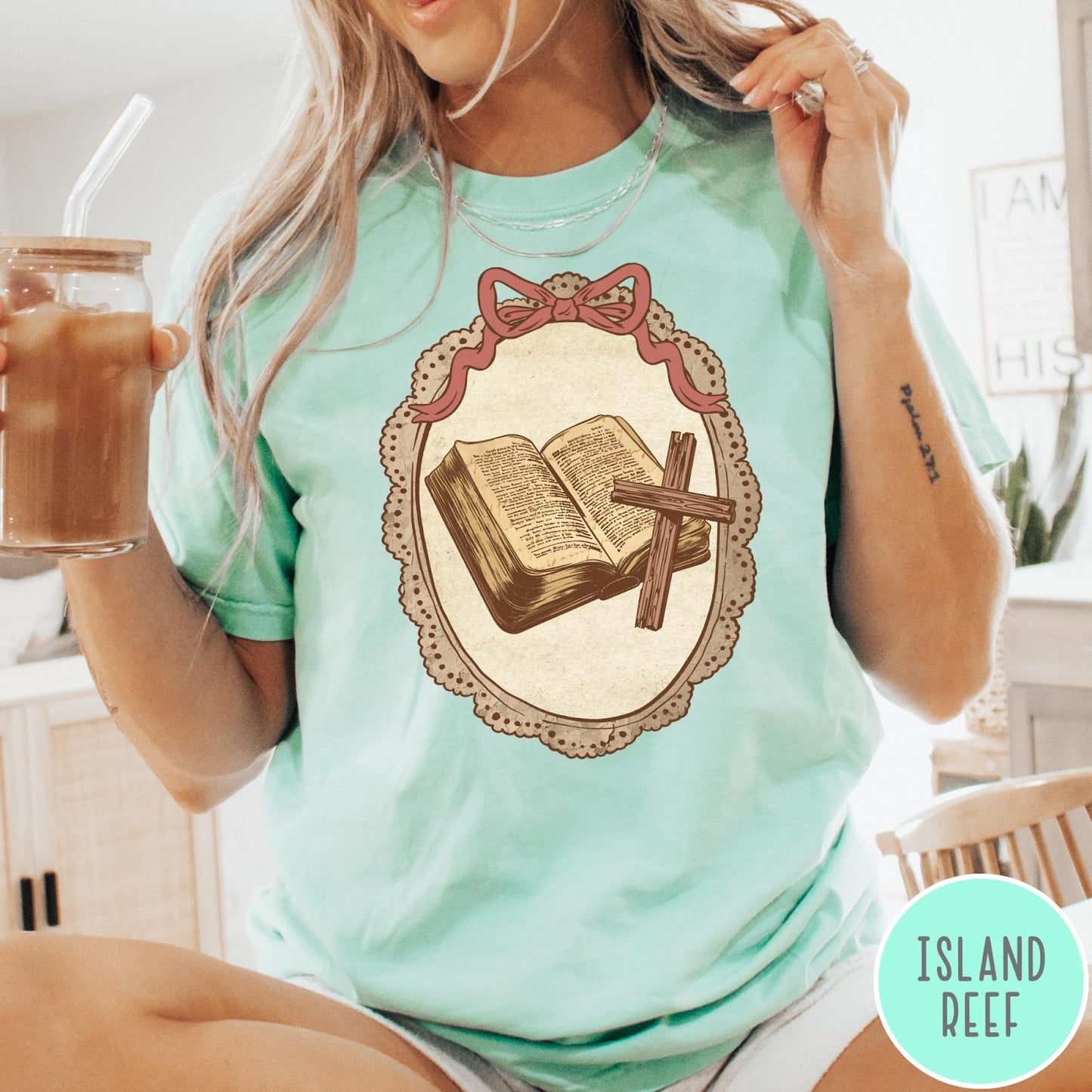 Comfort Colors tee in Island Reef featuring vintage style graphic of an open Bible and wooden Christian cross.