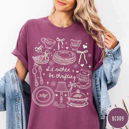 Comfort Colors tee in Berry featuring line art graphic of antique home goods and thrifting items