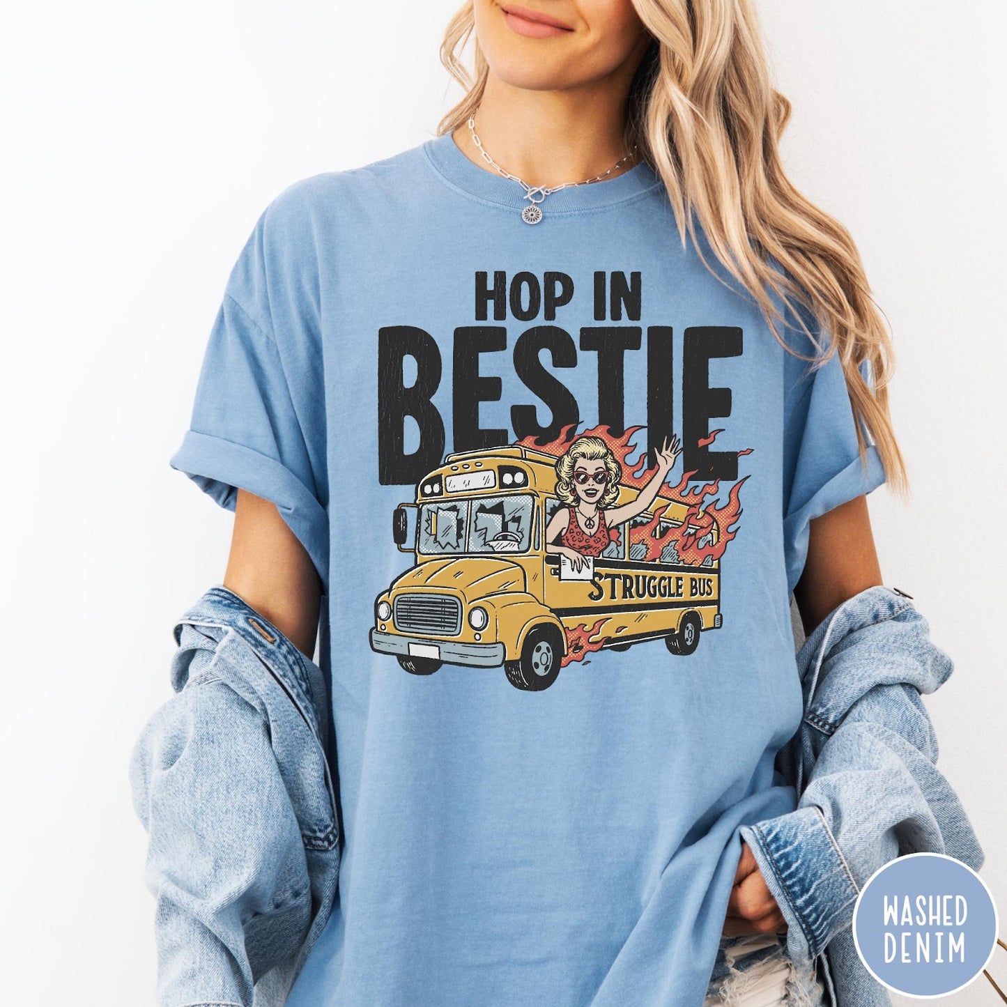 Comfort Colors tee in Washed Denim featuring retro cartoon style graphic of a woman driving a burning bus