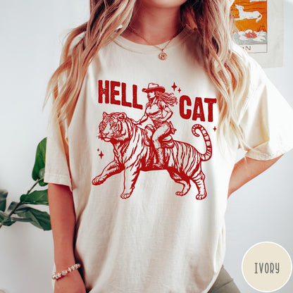 Comfort Colors tee in Ivory featuring western style graphic of a cowgirl riding a tiger