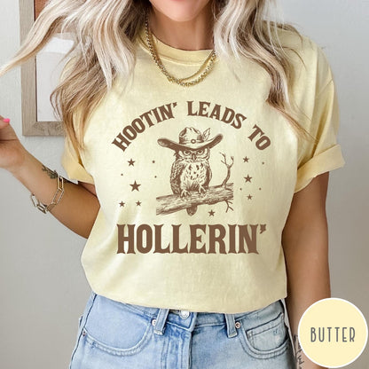 Comfort Colors tee in Butter featuring western style graphic of an owl wearing a cowboy hat on branch