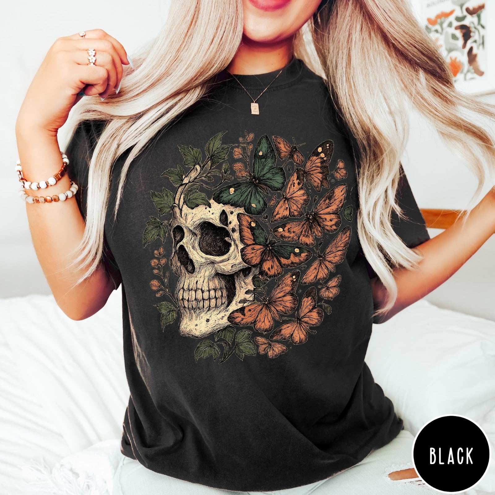 Comfort Colors tee in Black featuring vintage style graphic with a skull surrounded by various colorful butterflies