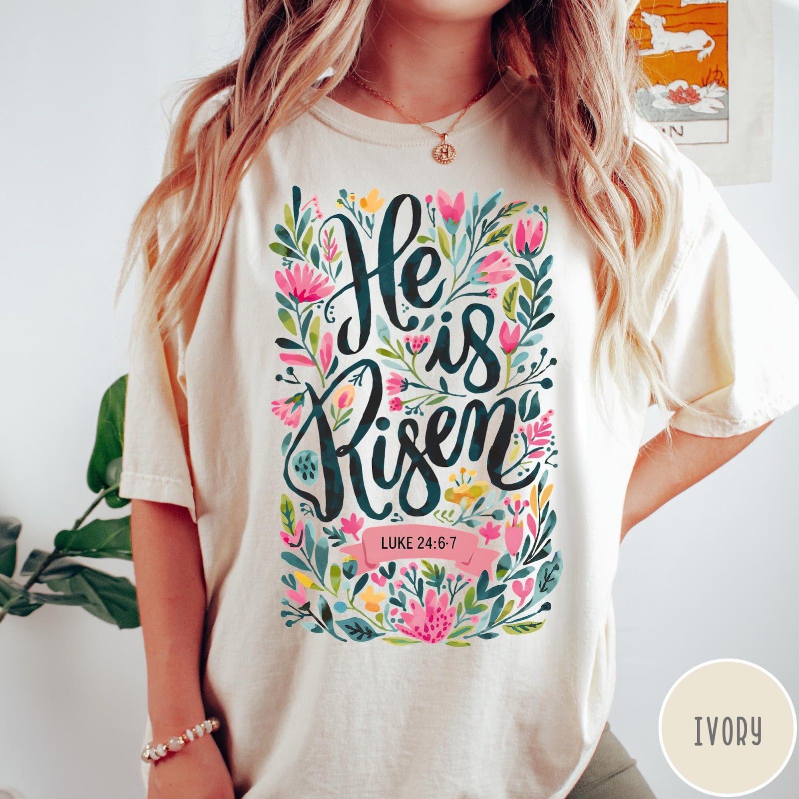 Comfort Colors tee in Ivory featuring Easter religious floral graphic with He is Risen and Luke 24:6-7 text