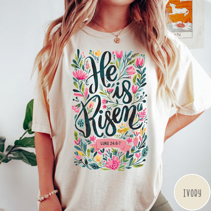 Comfort Colors tee in Ivory featuring Easter religious floral graphic with He is Risen and Luke 24:6-7 text