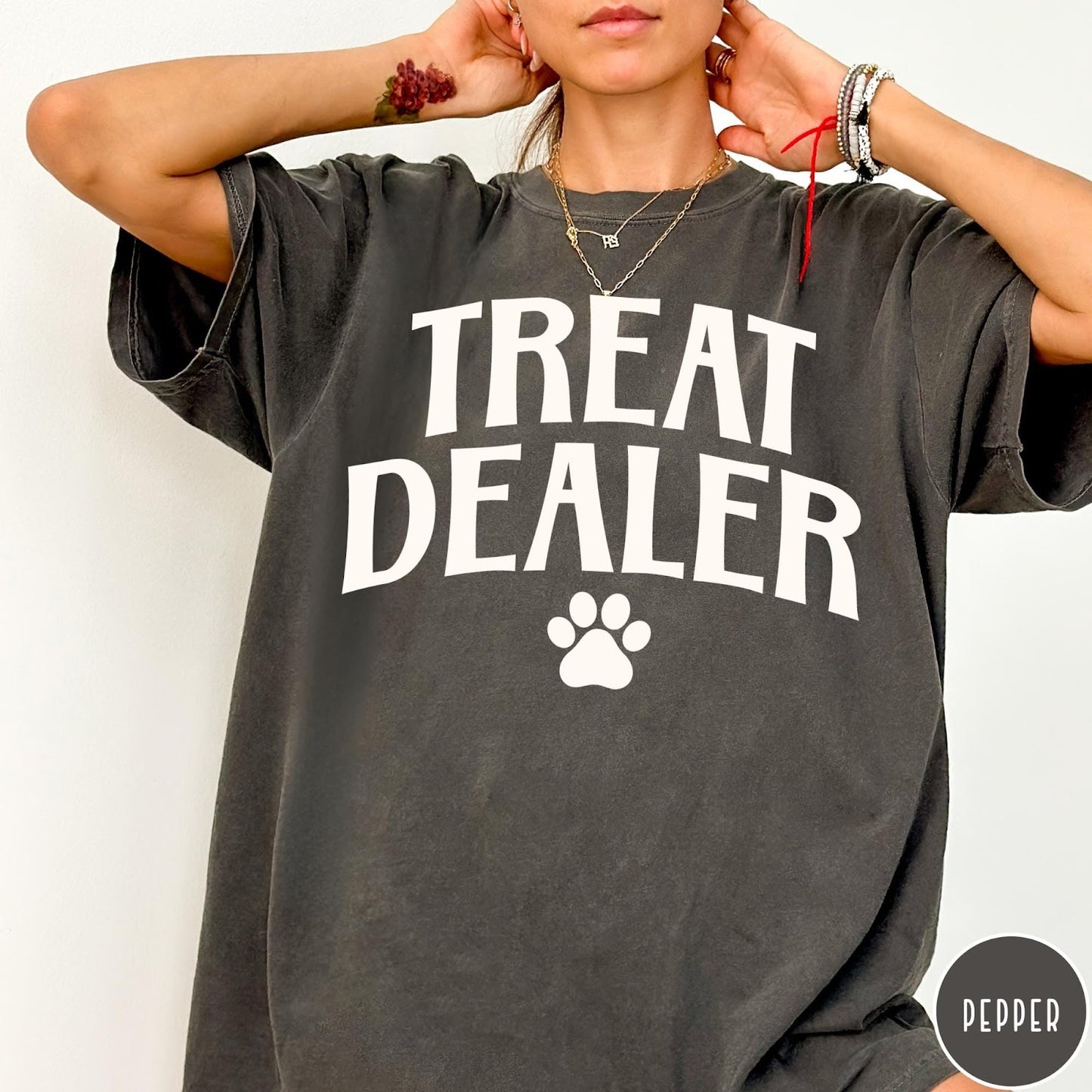 Comfort Colors tee in Pepper featuring dog owner design style with Treat Dealer text and paw print