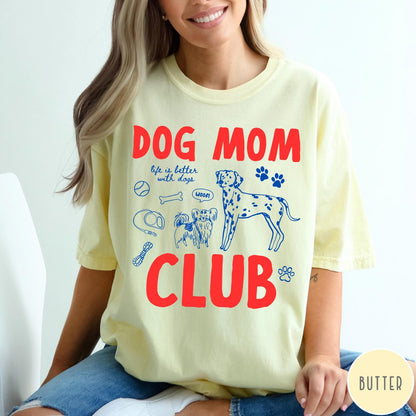 Comfort Colors tee in Butter featuring playful dog-themed graphic with Dalmatian and text Dog Mom Club