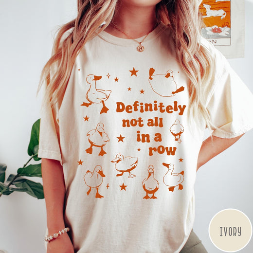 Comfort Colors tee in Ivory featuring whimsical duck design with scattered stars and text about ducks.