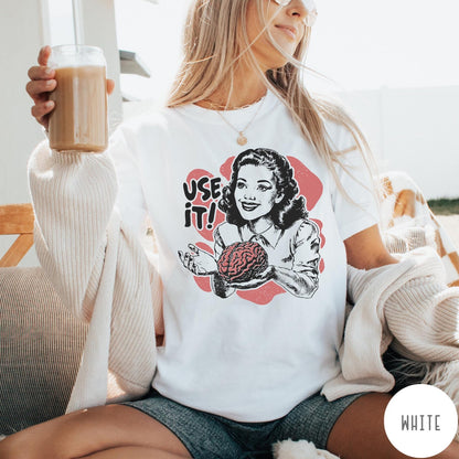 Comfort Colors tee in White featuring retro style graphic of a woman holding a human brain