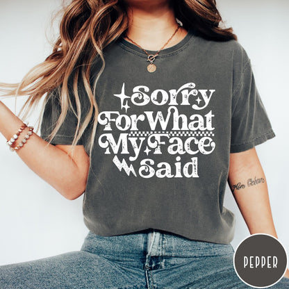 Comfort Colors tee in Pepper featuring sarcastic expression graphic with Sorry For What My Face Said text