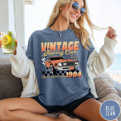Comfort Colors tee in Blue Jean featuring vintage muscle car graphic with racing flags and 1984 text