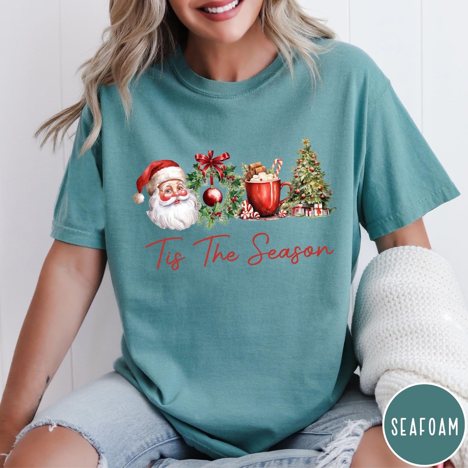 Comfort Colors tee in Seafoam featuring holiday design with Santa, wreath, hot cocoa, and Christmas tree graphic