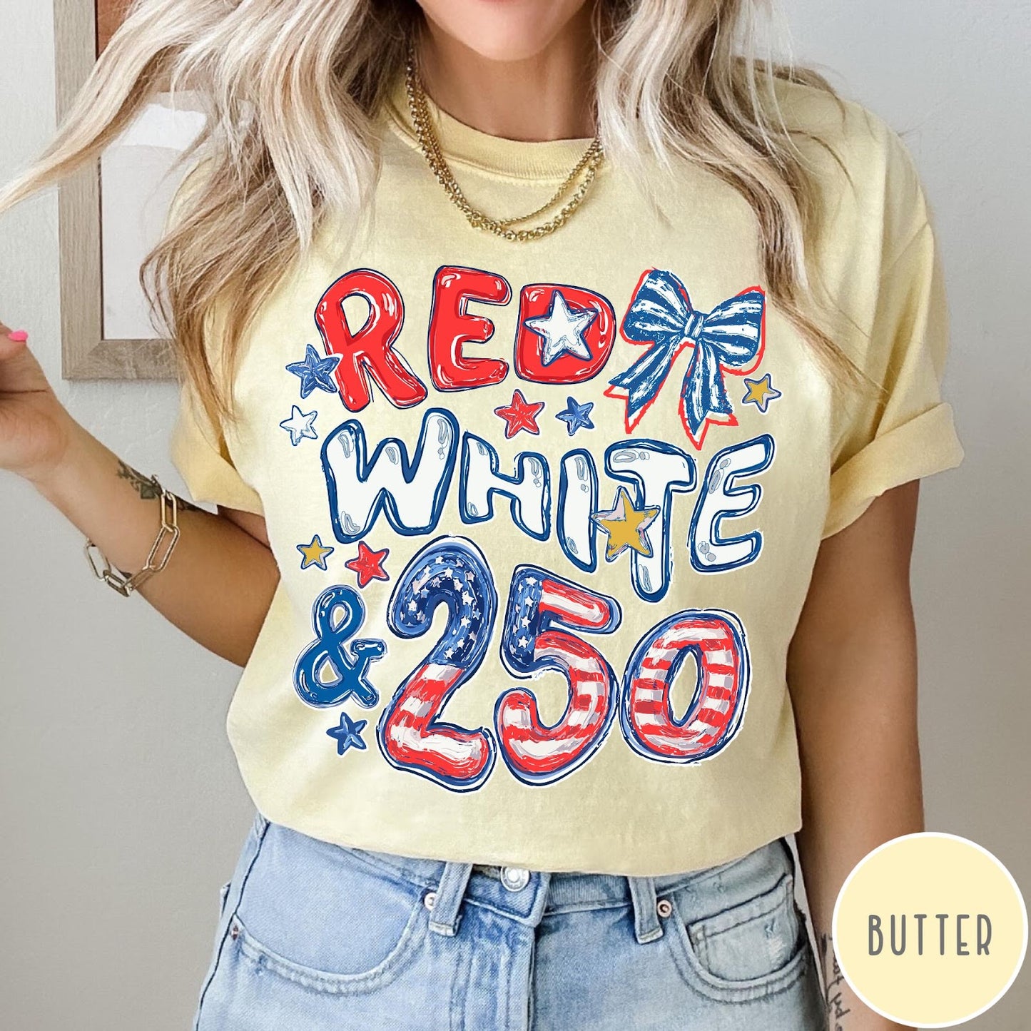 Comfort Colors tee in Butter featuring patriotic 250th anniversary graphic with red white and blue stars