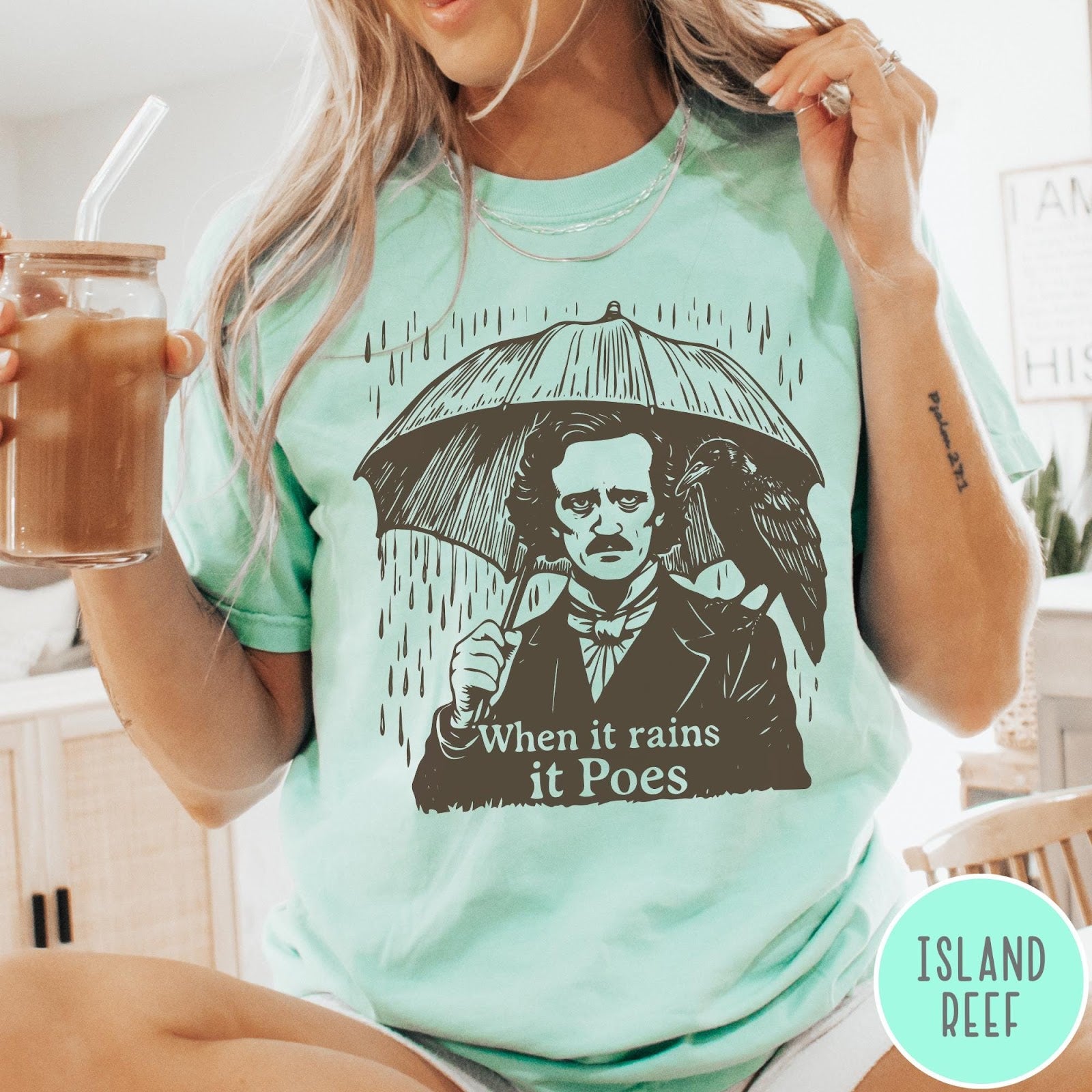 Comfort Colors tee in Island Reef featuring graphic illustration of Edgar Allan Poe with umbrella and raven