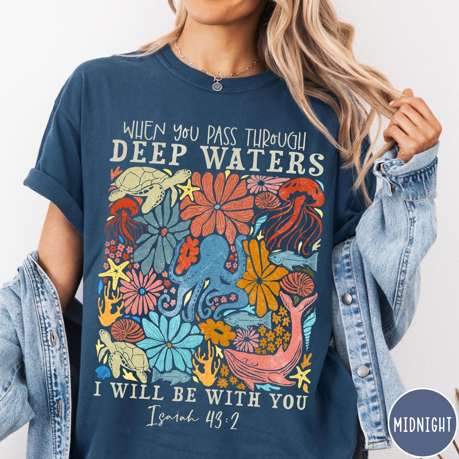 Comfort Colors tee in Midnight featuring retro style ocean life graphic with Isaiah 43:2 Bible verse text