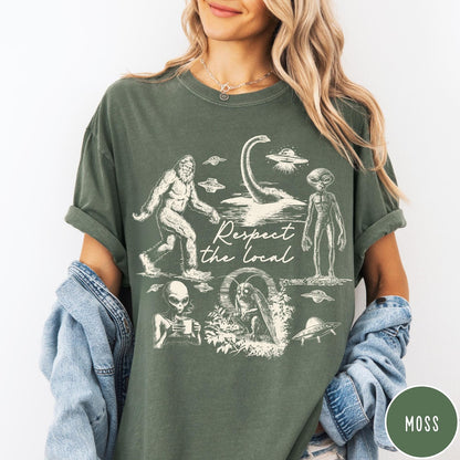 Comfort Colors tee in Moss featuring vintage style graphic of Bigfoot, Loch Ness Monster, aliens, and UFOs