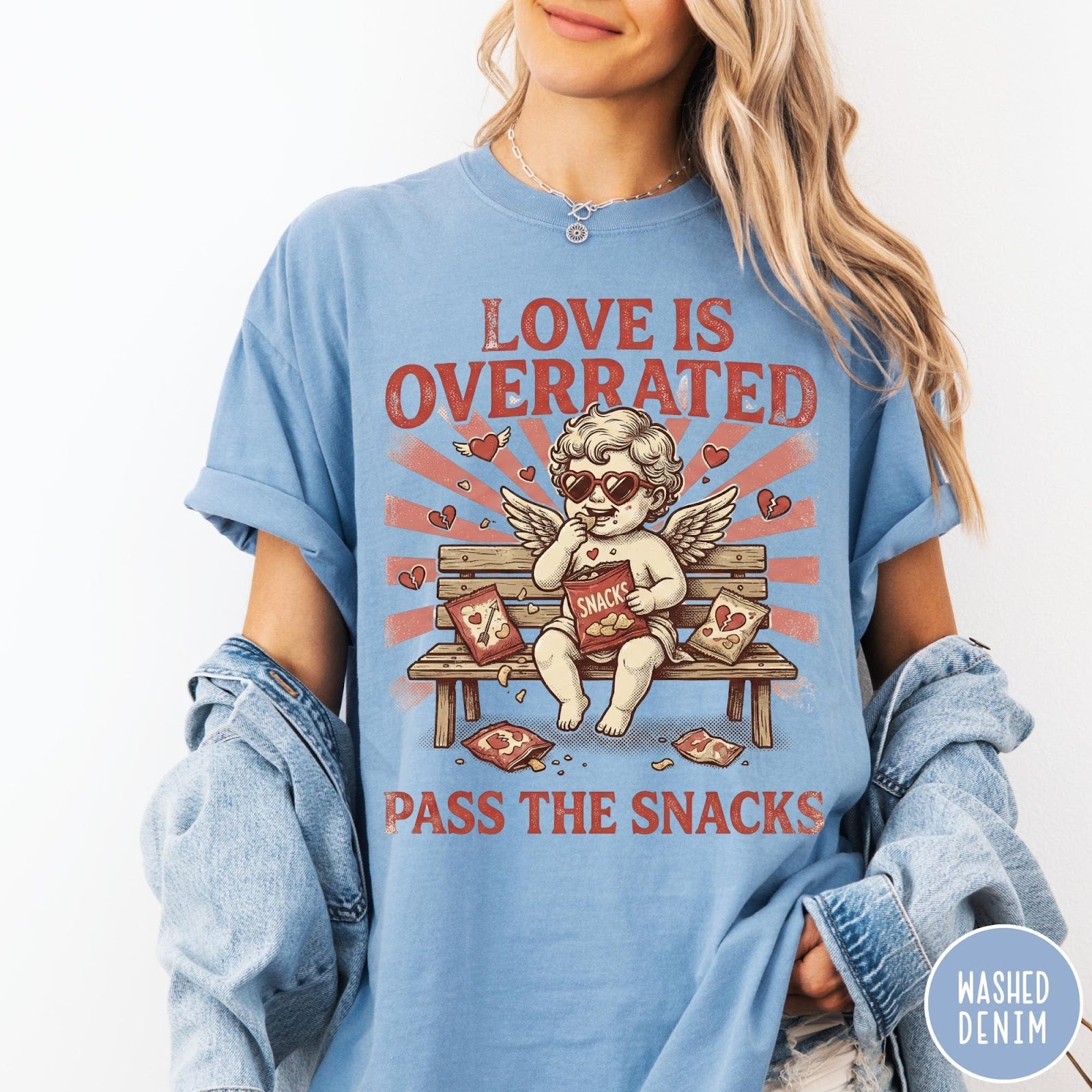 Comfort Colors tee in Washed Denim featuring vintage style graphic of a cherub eating snacks on a bench
