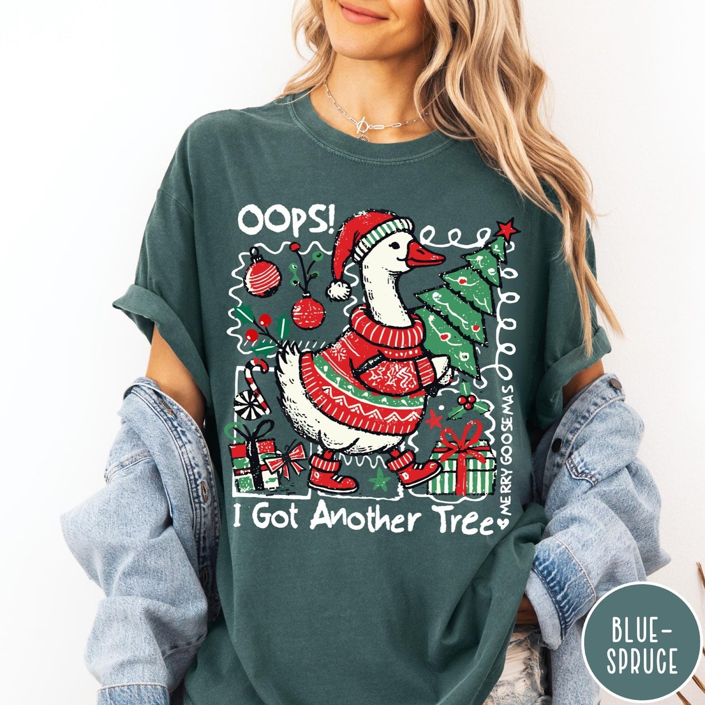 Comfort Colors tee in Blue Spruce featuring festive graphic design of a goose wearing a sweater and hat