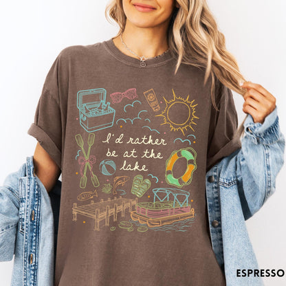 Comfort Colors tee in Espresso featuring lake vacation graphic with pontoon boat, dock, and summer accessories