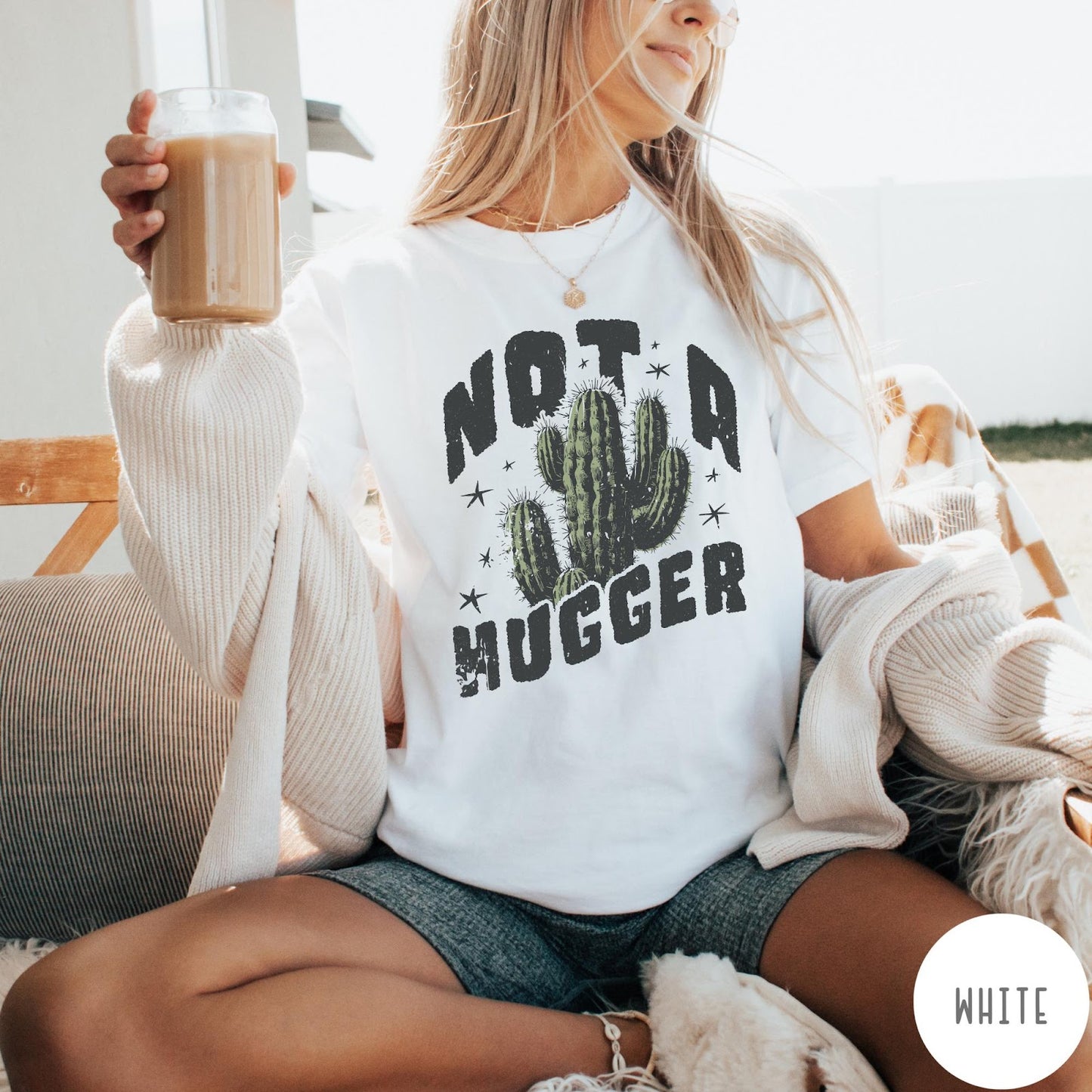 Comfort Colors tee in White featuring cactus graphic and Not a Hugger text with small stars