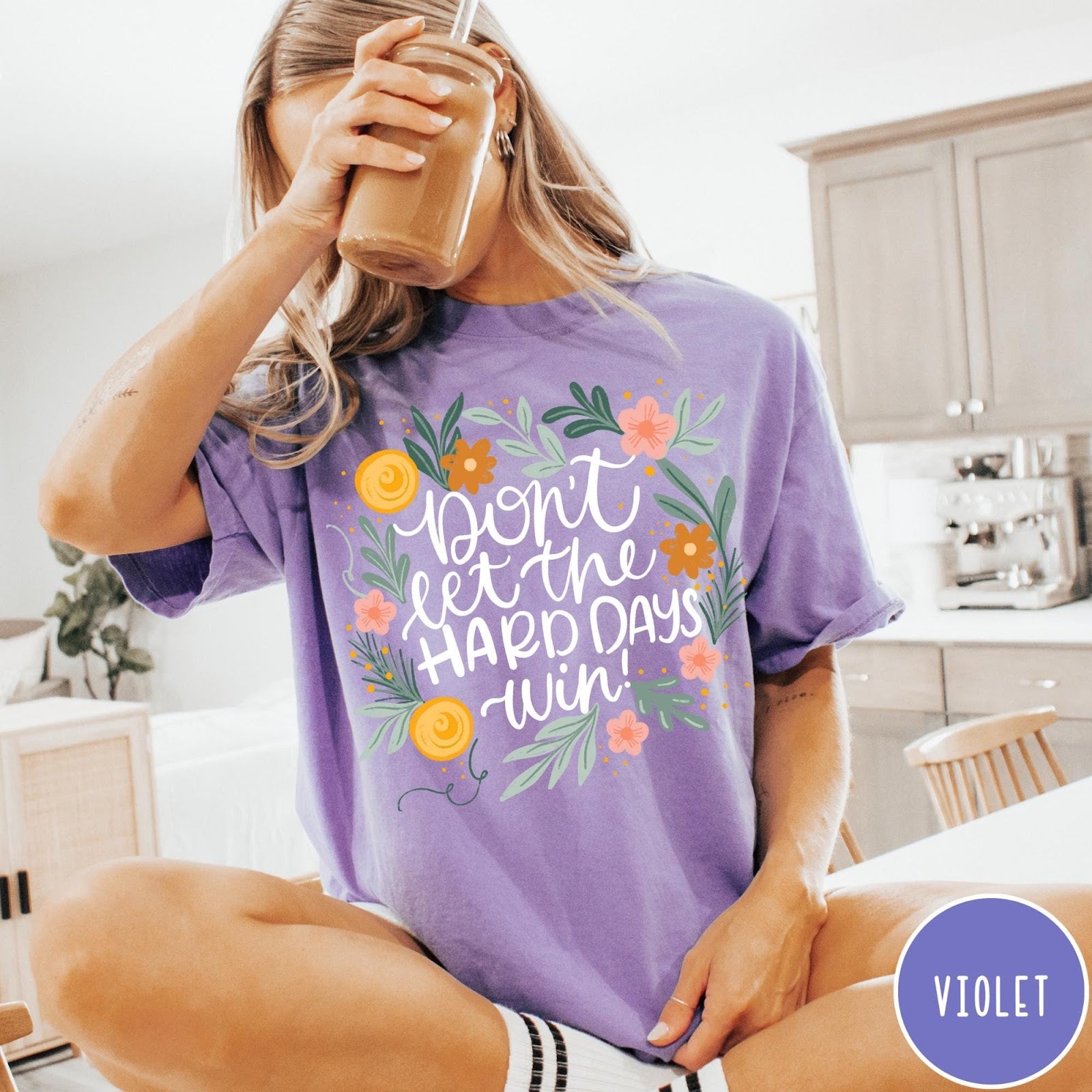 Comfort Colors tee in Violet featuring floral mental health encouragement graphic with the text Don't Let The Hard Days Win