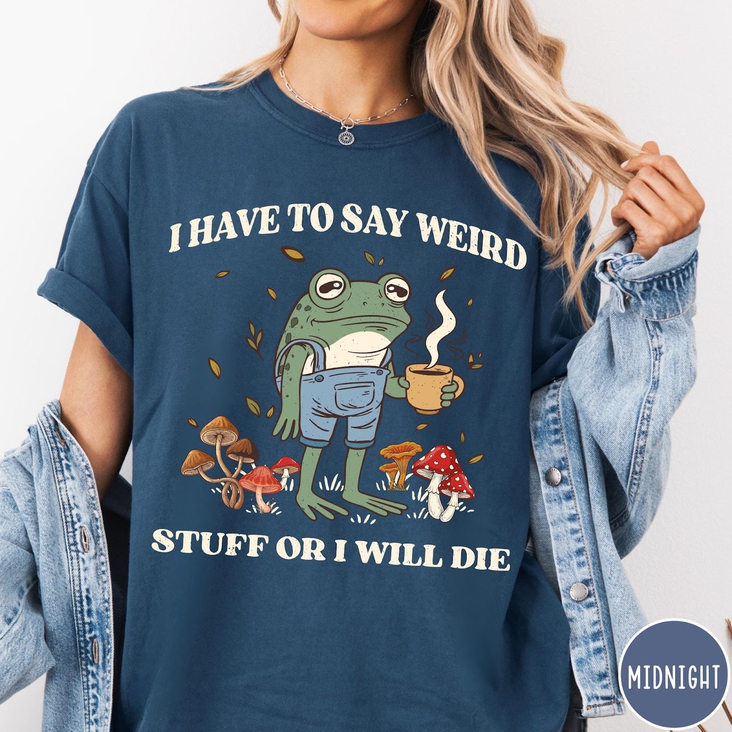 Comfort Colors tee in Midnight featuring cartoon style frog wearing overalls holding a coffee mug with mushrooms