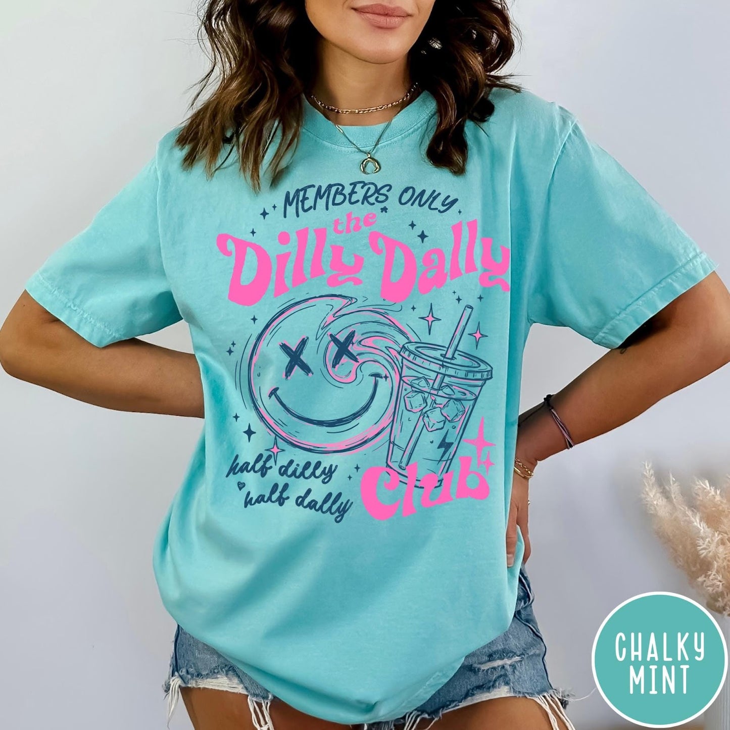 Comfort Colors tee in Chalky Mint featuring Dilly Dally Club graphic with smiley face and iced coffee cup