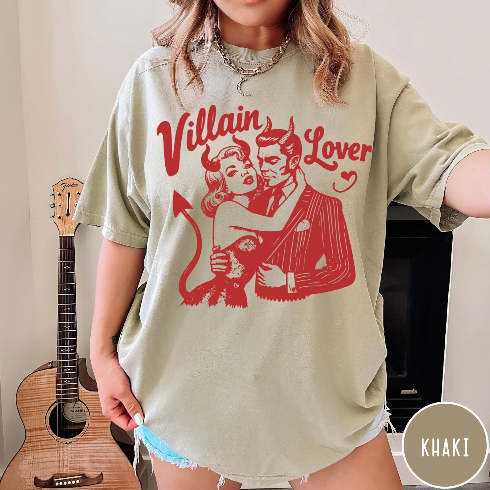 Comfort Colors tee in Khaki featuring vintage style graphic of a devilish couple embracing each other