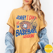 Comfort Colors tee in Mustard featuring baseball style graphic with glove, ball, bat, and iced coffee drink