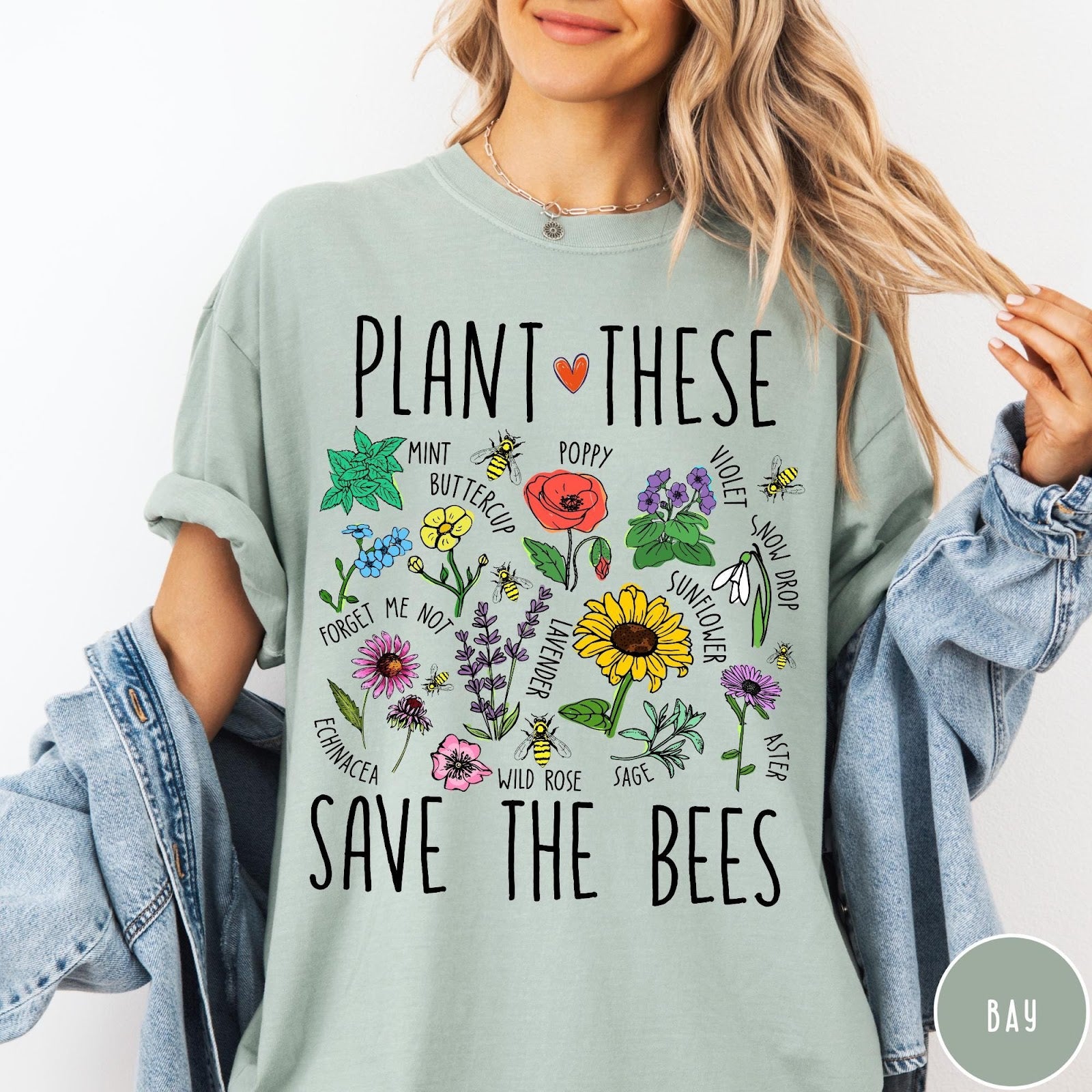 Comfort Colors tee in Bay featuring botanical garden style graphic with various flowers and bees