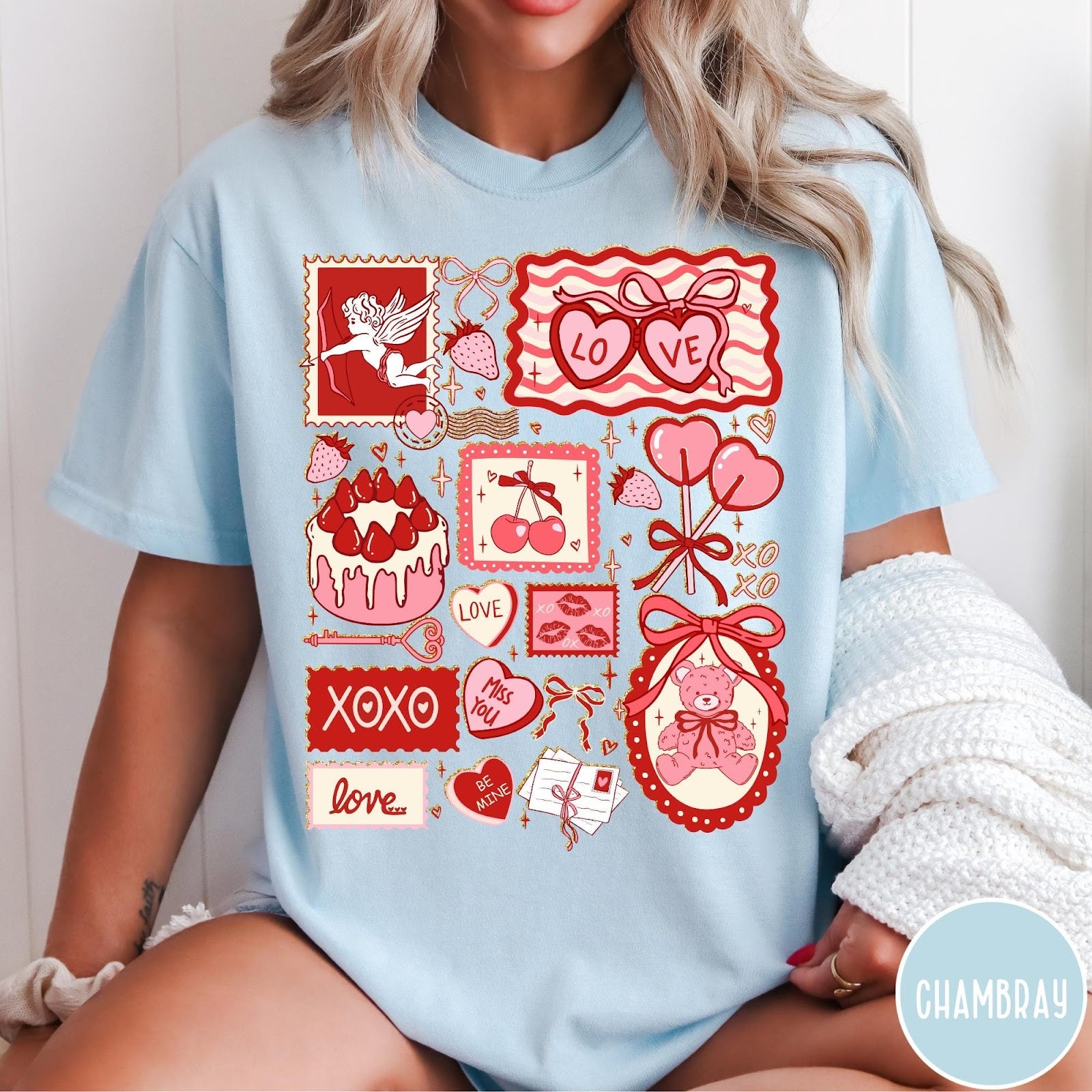 Comfort Colors tee in Chambray featuring Valentine collage graphic with cupid, teddy bear, hearts, and sweet treats