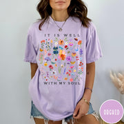 Comfort Colors tee in Orchid featuring wildflower bouquet graphic and It Is Well With My Soul text