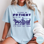 Comfort Colors tee in Chambray featuring pixel art style graphic of a horse drawn covered wagon