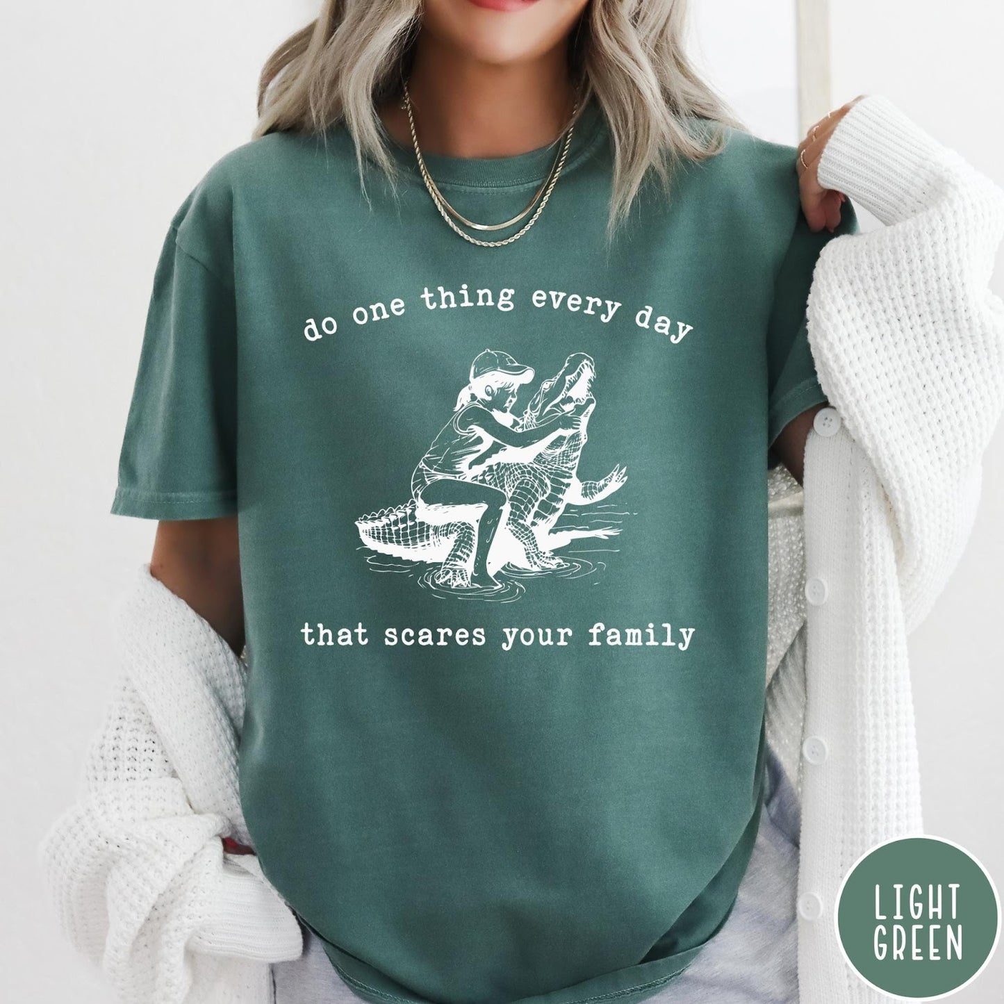 Comfort Colors tee in Light Green featuring vintage style graphic of a girl wrestling an alligator