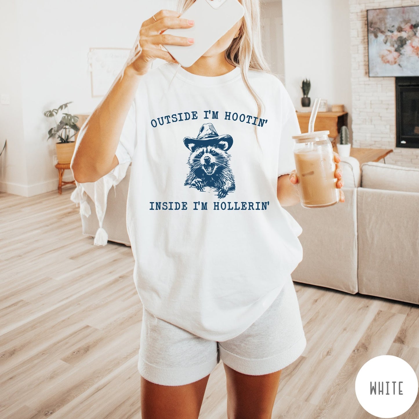 Comfort Colors tee in White featuring western style graphic of a raccoon wearing a cowboy hat