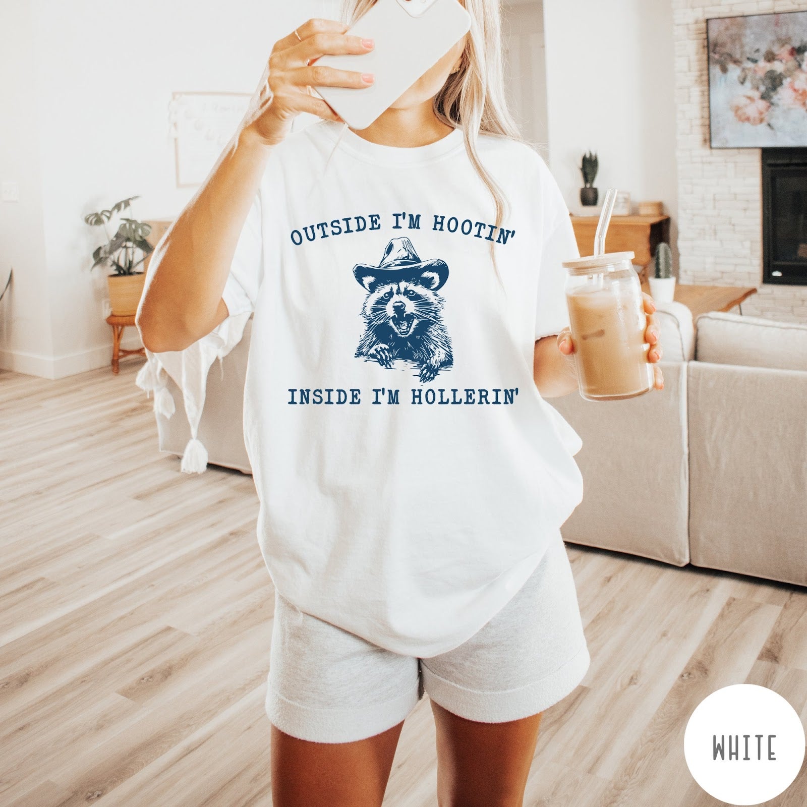 Comfort Colors tee in White featuring western style graphic of a raccoon wearing a cowboy hat