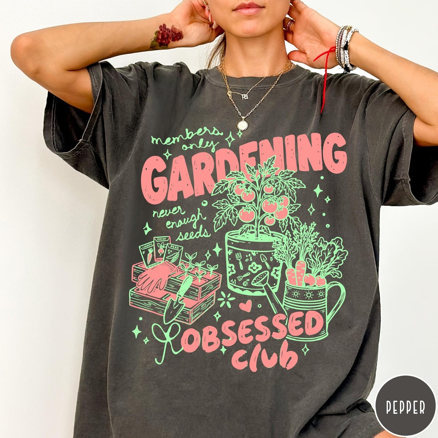 Comfort Colors tee in Pepper featuring retro graphic gardening design with tomato plant, seeds, and gardening tools