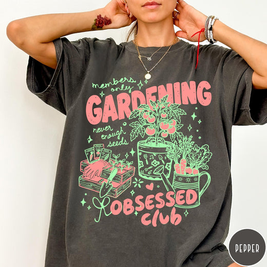 Comfort Colors tee in Pepper featuring retro graphic gardening design with tomato plant, seeds, and gardening tools