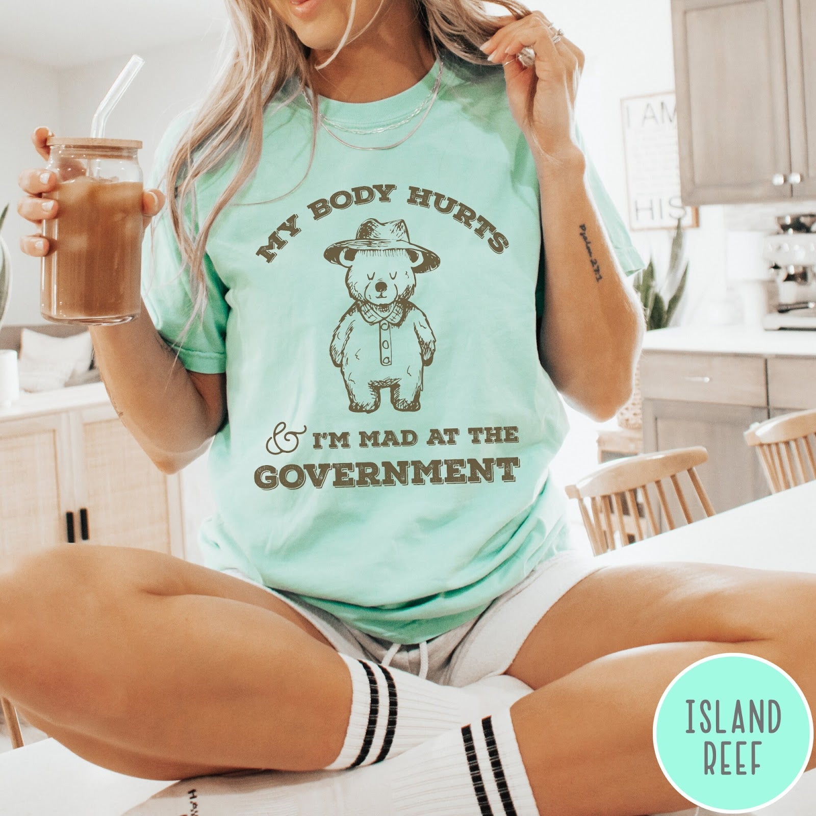 Comfort Colors tee in Island Reef featuring line art style bear wearing a hat and button-up shirt graphic